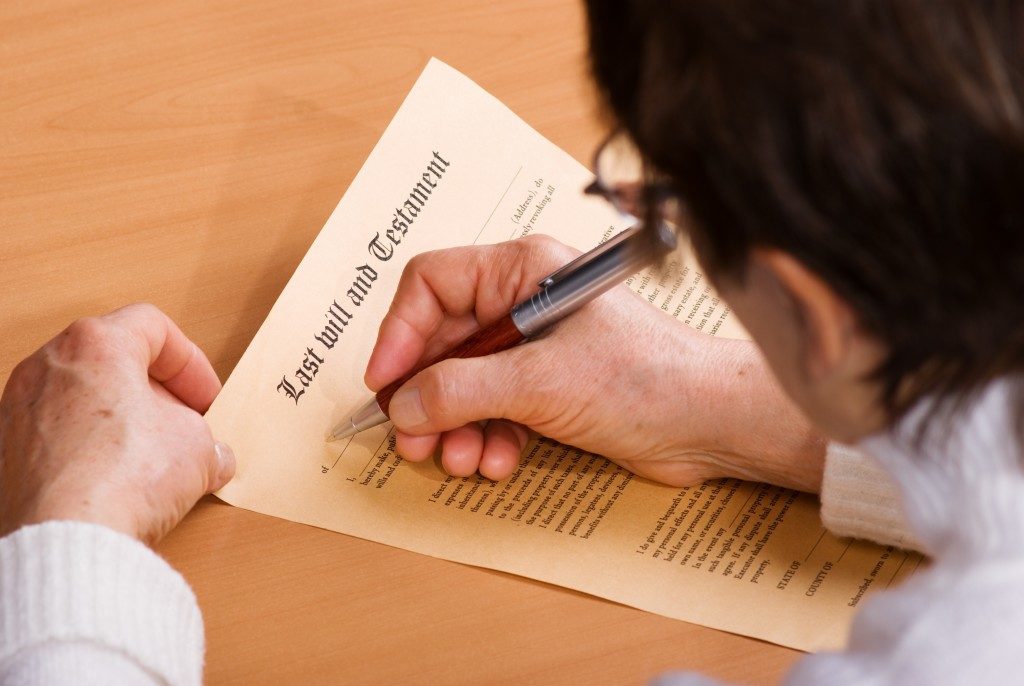 person writing his last will and testament