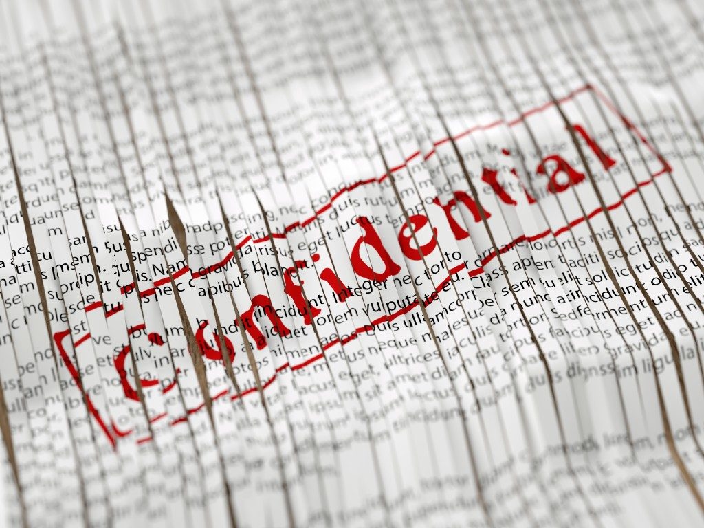 shredded papers read confidentials when placed next to each other
