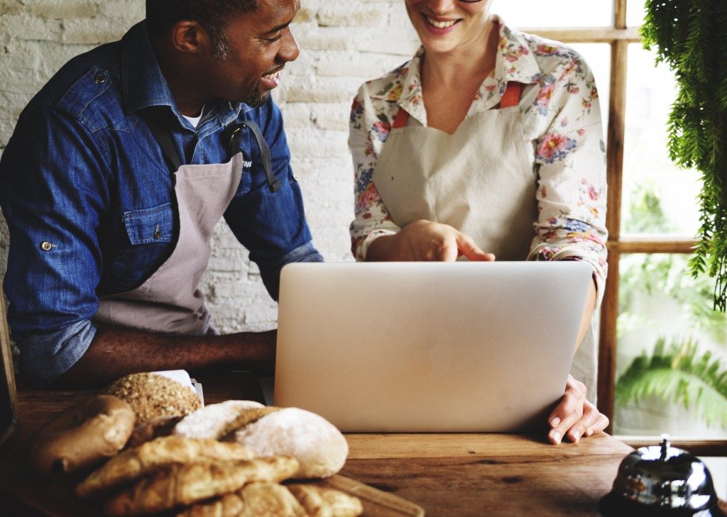 bakers working on a laptop