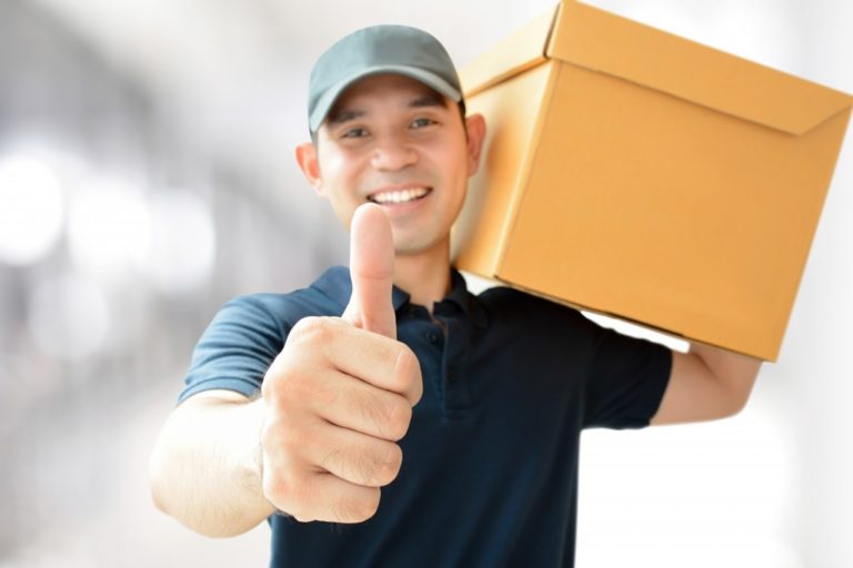delivery man giving a thumbs up