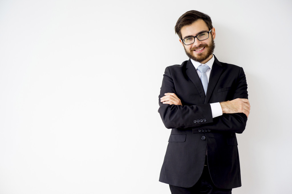 man leaning on a wall