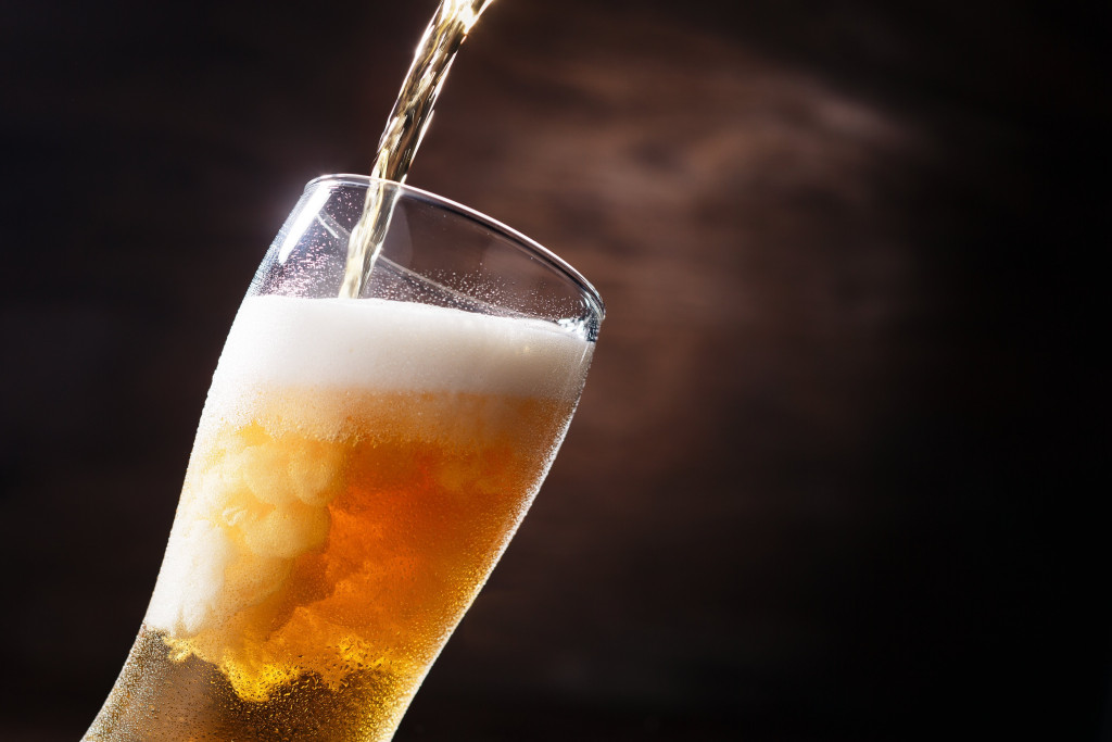 beer being poured to a glass