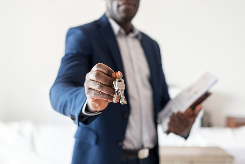A real estate manager giving you the keys