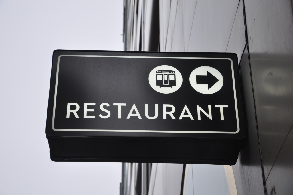 A black restaurant sign