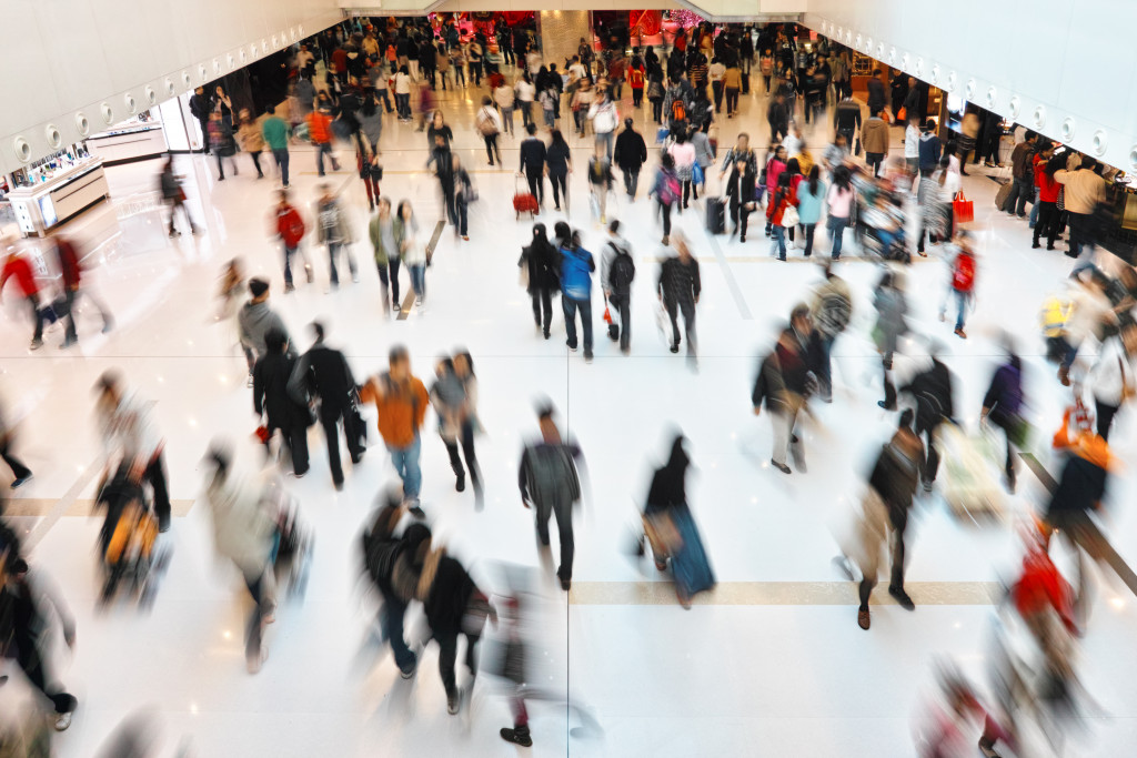 People walking around a busy shopping mall
