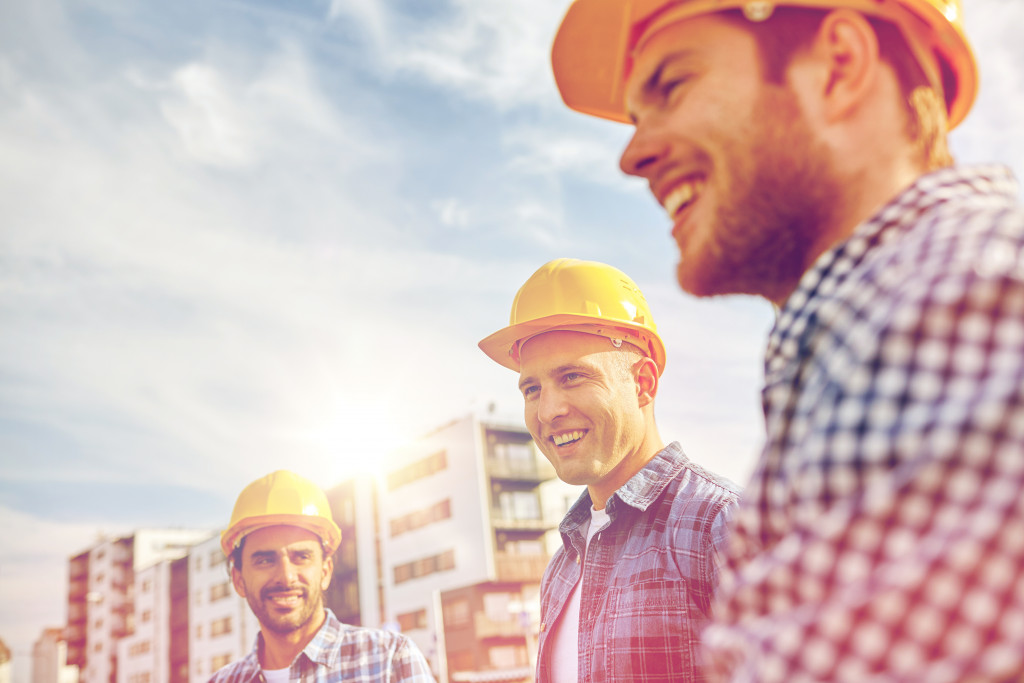 Construction workers wearing yellow hard hats on a construction site