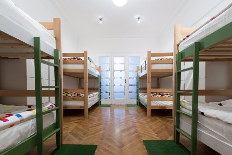 an interior of hostel with double decker beds