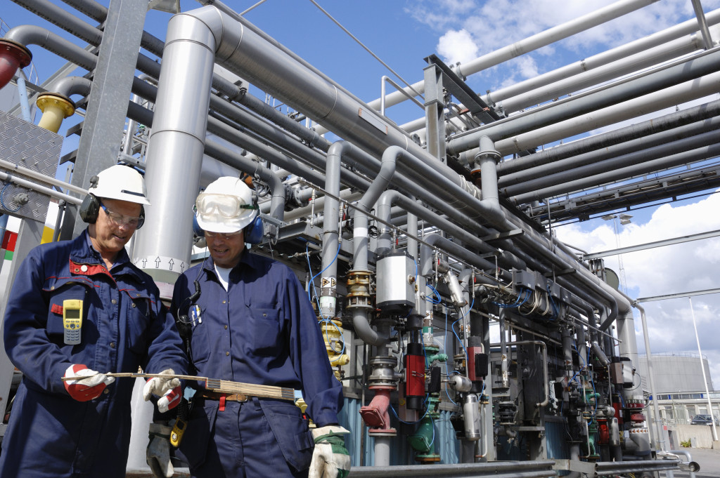 Factory workers doing maintenance work