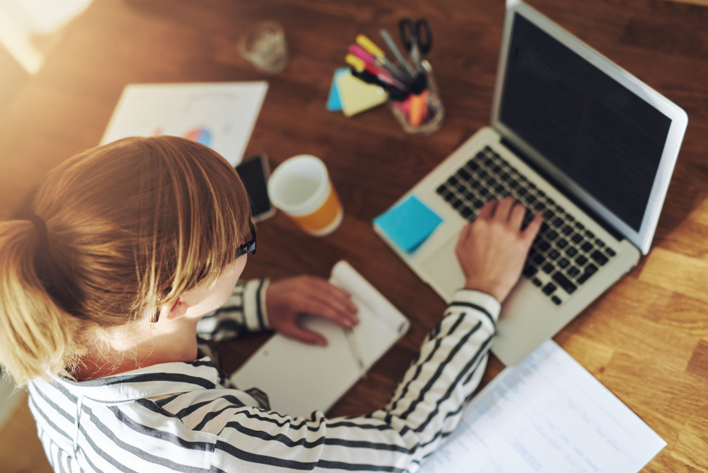 a woman working on her laptop
