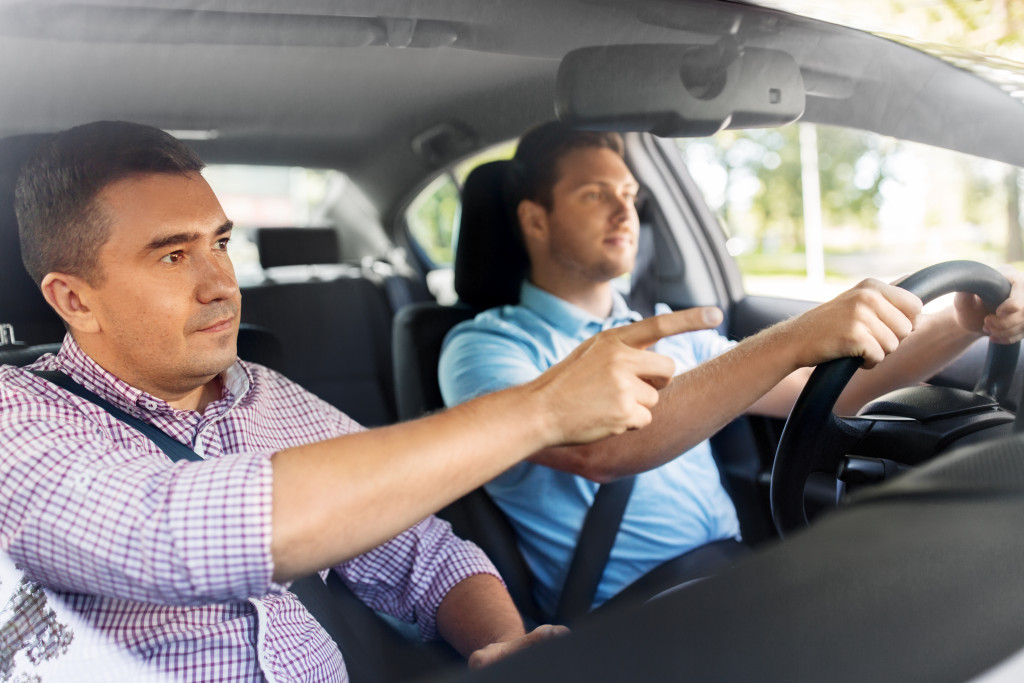 man training a driver for safety