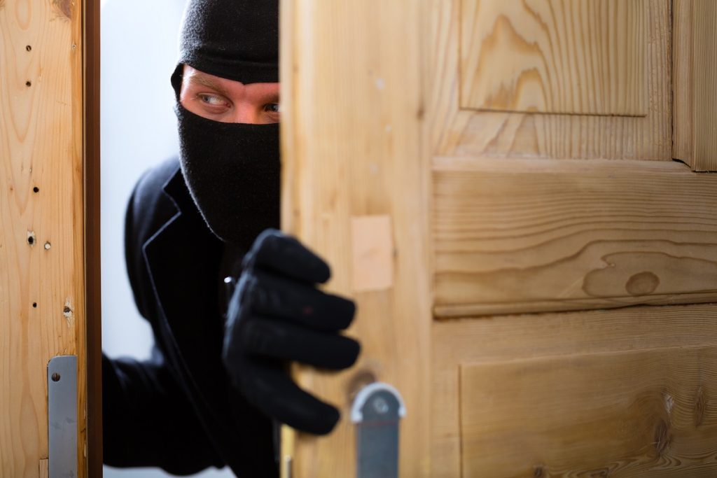 burglar breaking in an office