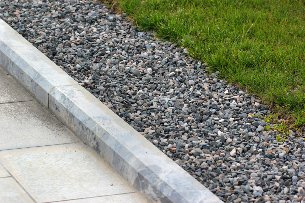 curb between lawn and sidewalk in a building